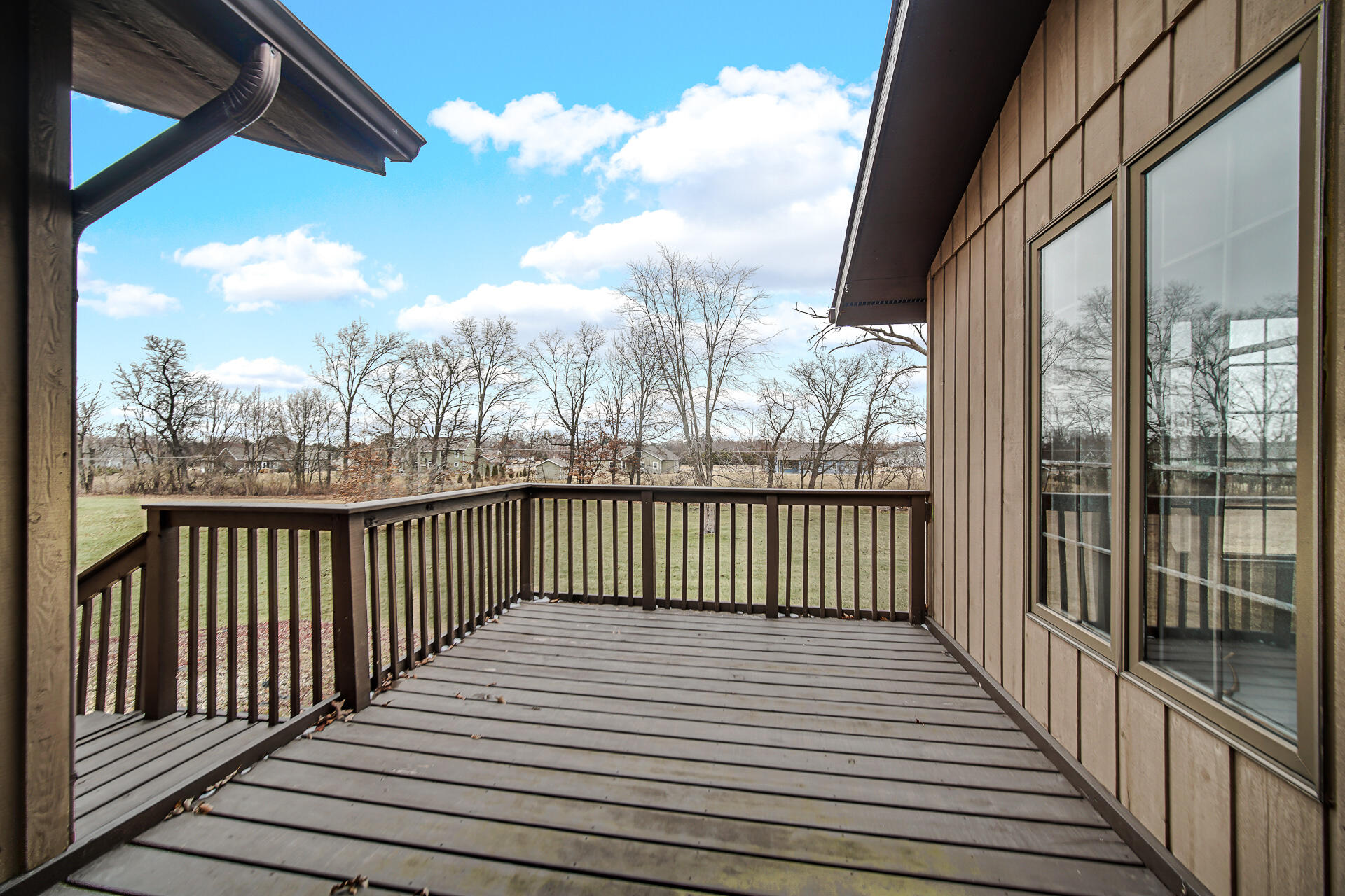 6955 Briergate Court Demotte, IN 46310 - Photo 40 of 44 a view of a balcony with wooden floor