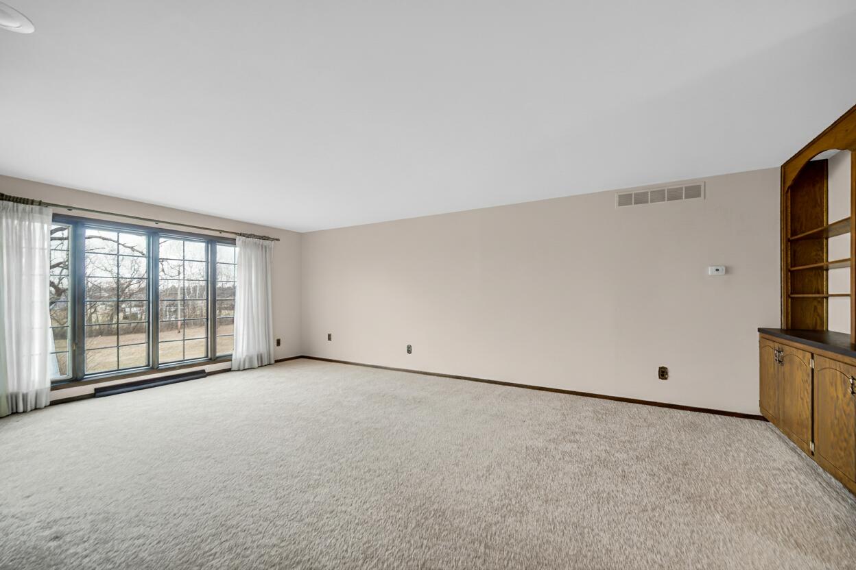 6955 Briergate Court Demotte, IN 46310 - Photo 4 of 44 a view of an empty room with a window