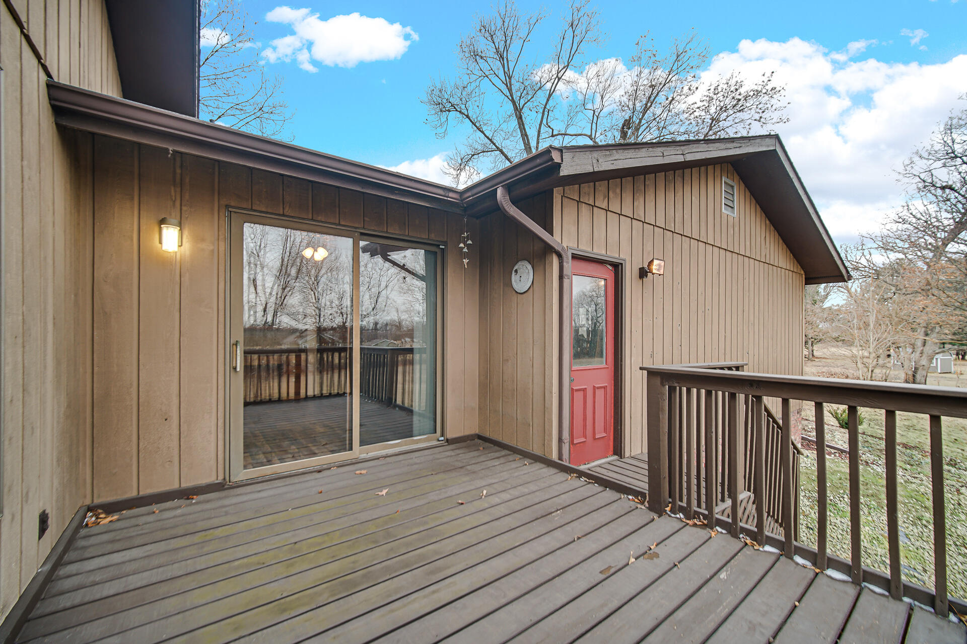 6955 Briergate Court Demotte, IN 46310 - Photo 41 of 44 a yellow house with wooden floor and seating space
