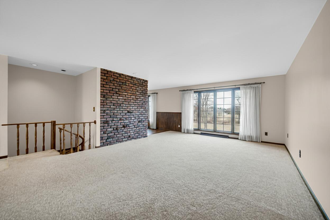 6955 Briergate Court Demotte, IN 46310 - Photo 6 of 44 a view of an empty room with a window