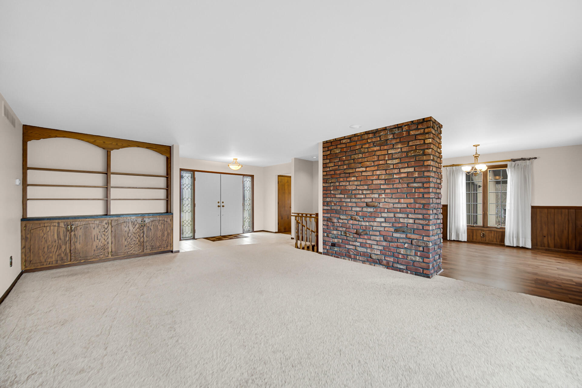 6955 Briergate Court Demotte, IN 46310 - Photo 8 of 44 a view of an empty room with a ceiling fan and window