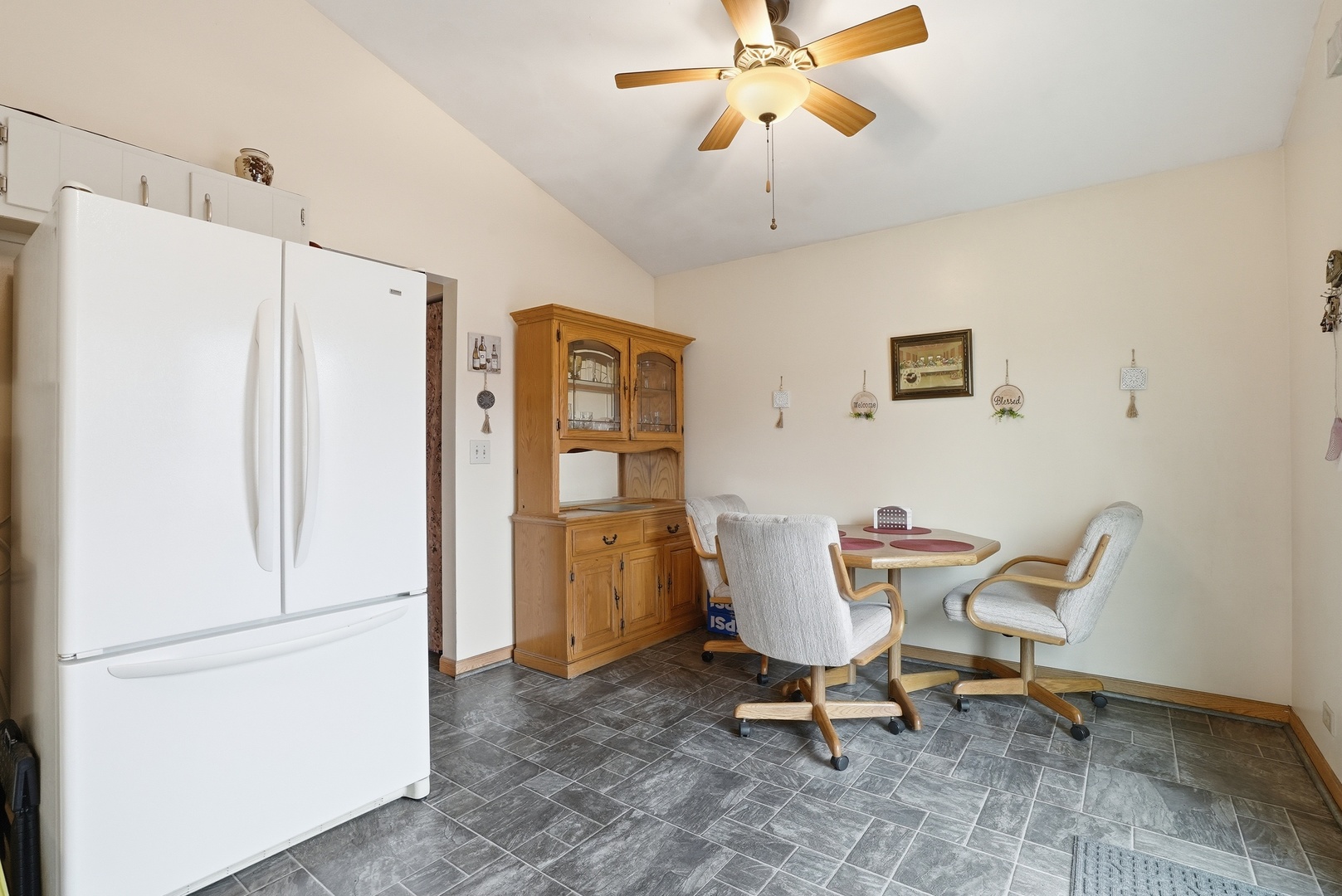 538 West Avenue Elmhurst, IL 60126 - Photo 6 of 22 a chair and a refrigerator in a room