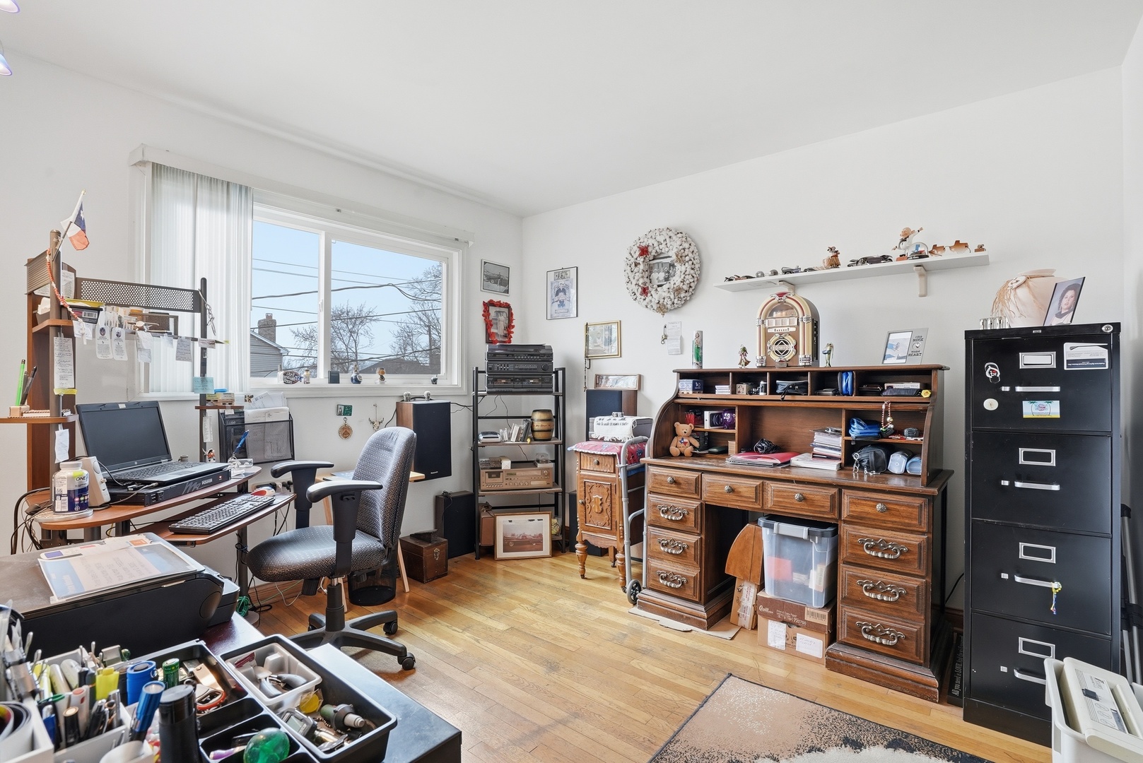 538 West Avenue Elmhurst, IL 60126 - Photo 9 of 22 a view of a workspace with furniture and a window