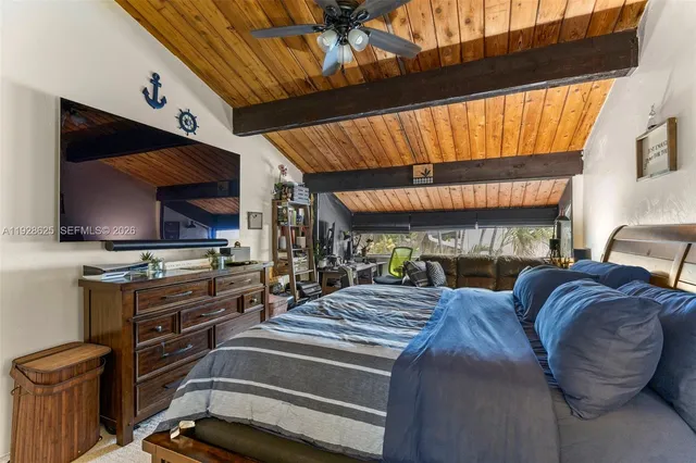 a bedroom with furniture and a window