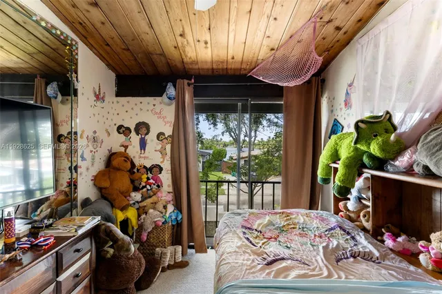 a view of walk in closet with clothes