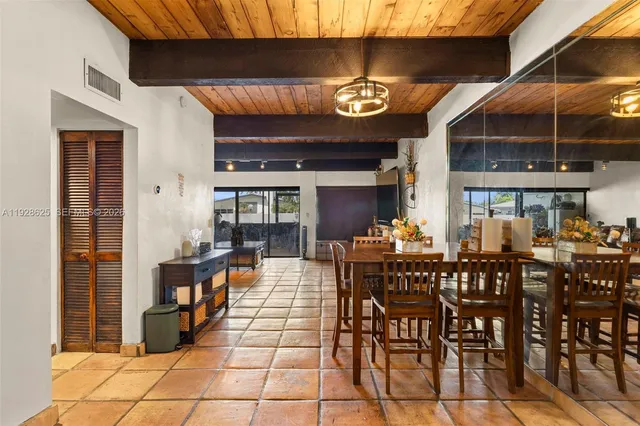 a view of a chairs and table in a patio