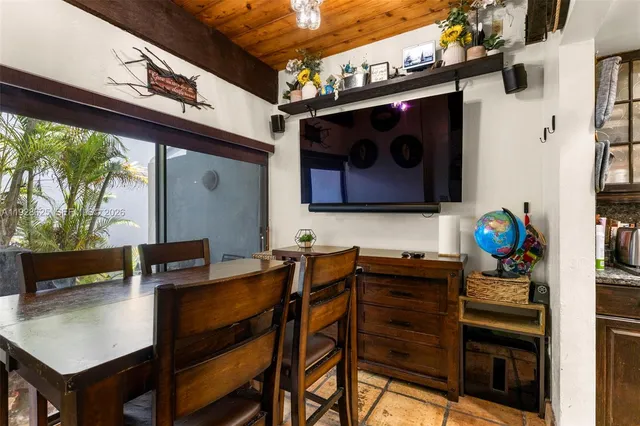 a kitchen with granite countertop a sink and cabinets
