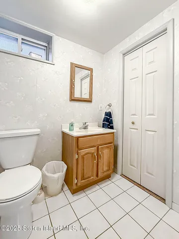 a bathroom with a sink toilet and vanity