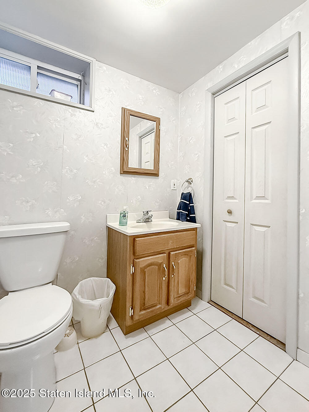 282 Boscombe Avenue Staten Island, NY 10309 - Photo 15 of 34 a bathroom with a sink toilet and vanity