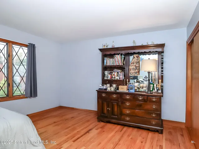 a bed room with a bed and a window