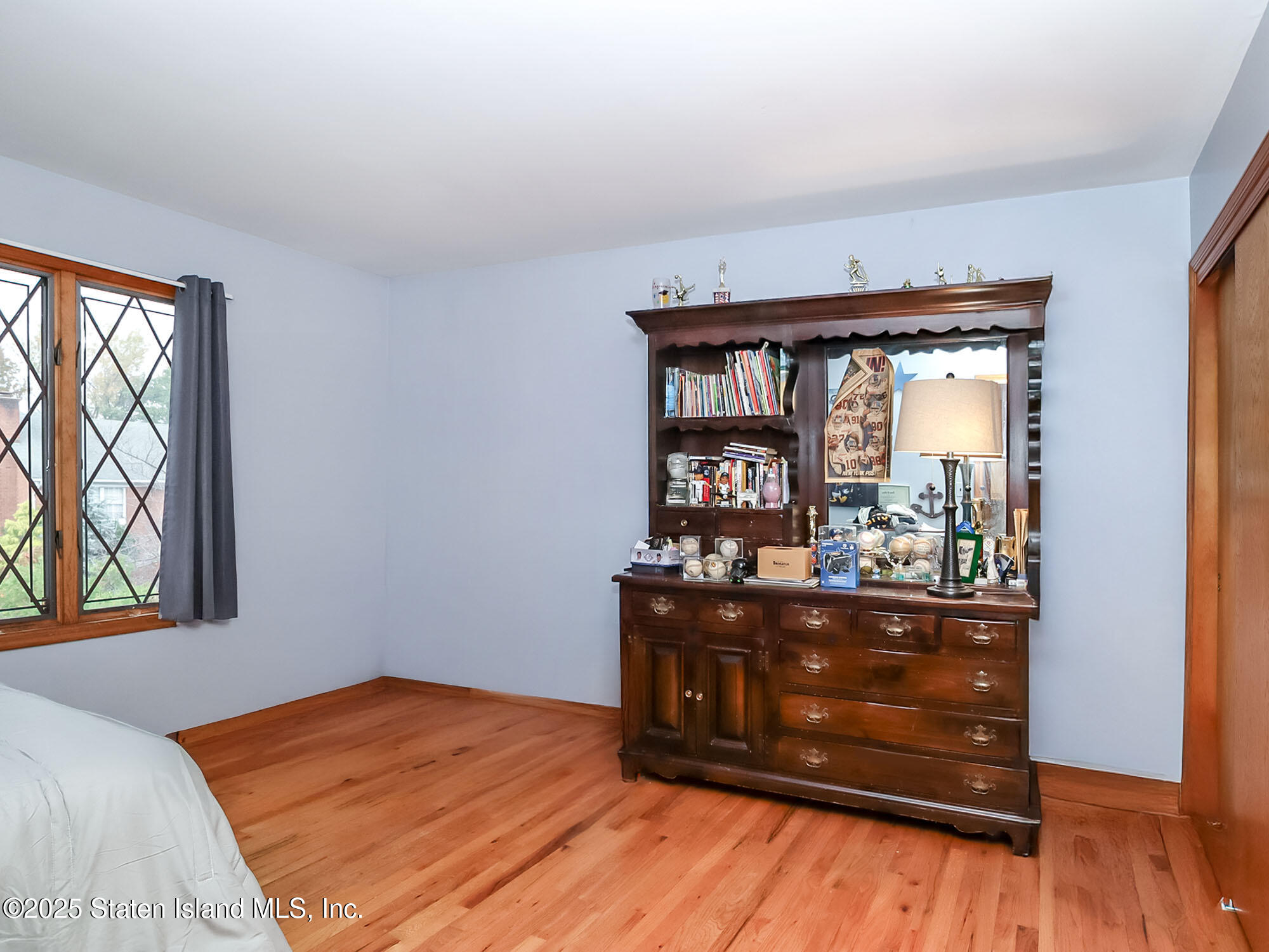 282 Boscombe Avenue Staten Island, NY 10309 - Photo 17 of 34 a bed room with a bed and a window