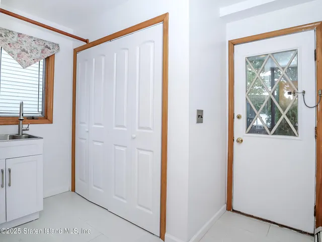 a view of an entryway with wooden floor