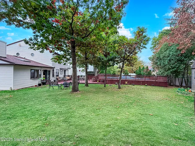 a view of a park with large trees