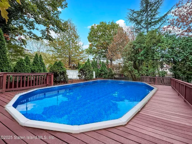 a view of a swimming pool with a deck