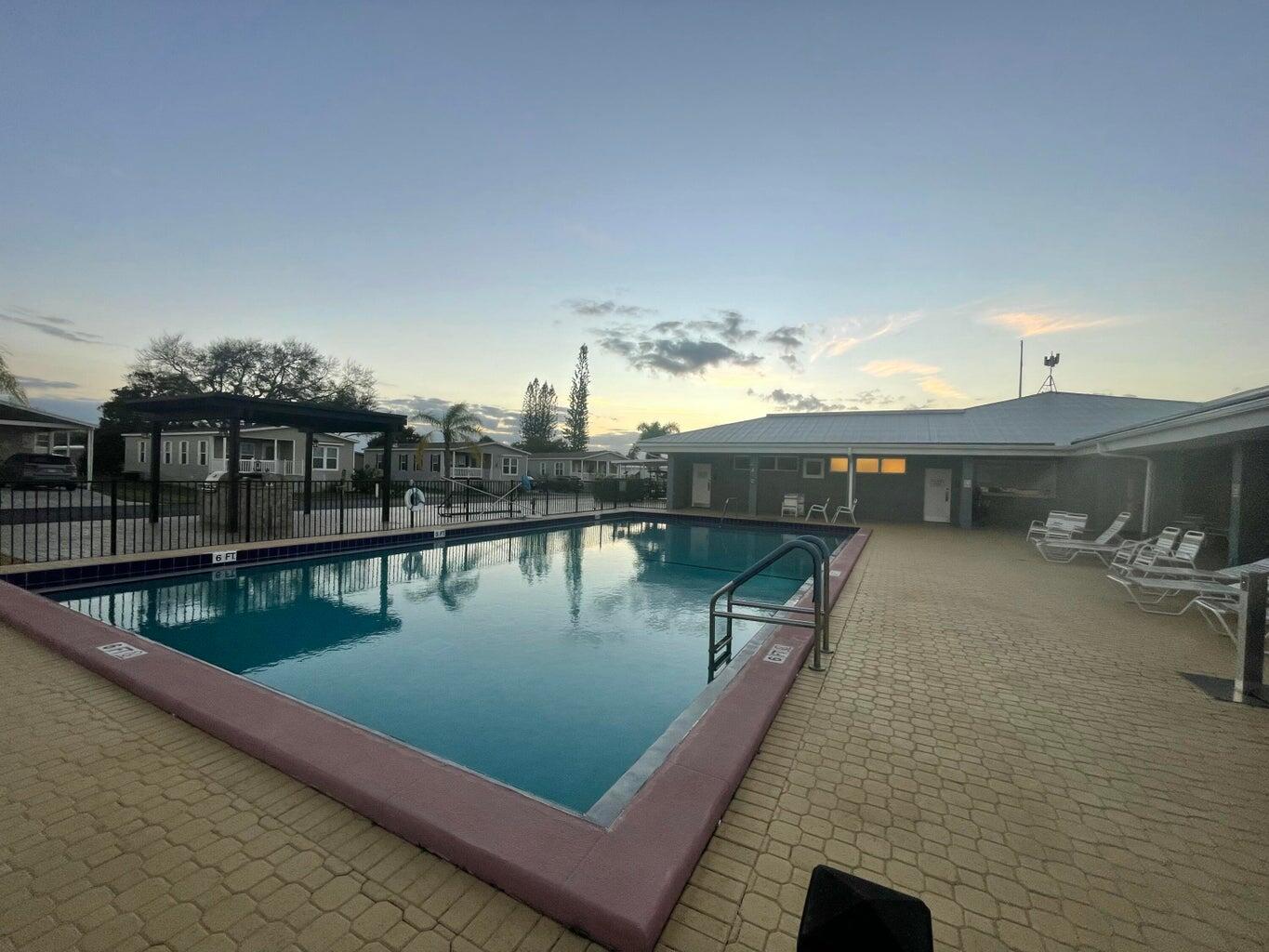 356 Mockingbird Avenue Fort Pierce, FL 34982 - Photo 12 of 12 a view of a balcony with two chairs