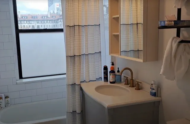 a bathroom with a sink and mirror
