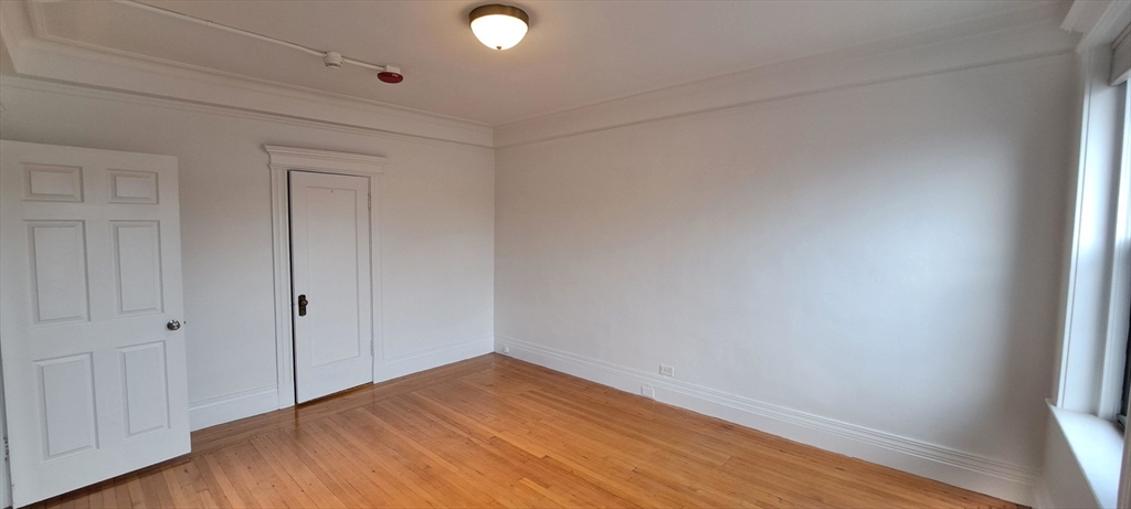 464 Commonwealth Avenue, Unit 44 Boston, MA 02215 - Photo 9 of 15 a view of empty room with wooden floor