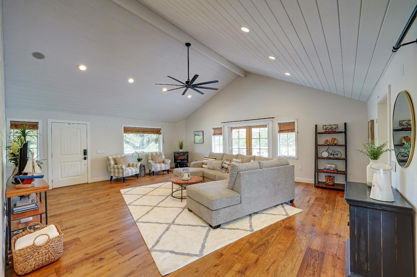 8495 Pharmer Road Gilroy, CA 95020 - Photo 11 of 70 a living room with furniture a flat screen tv and a window