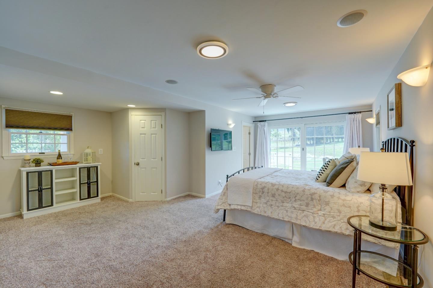 8495 Pharmer Road Gilroy, CA 95020 - Photo 23 of 70 a bedroom with a bed and wooden floor