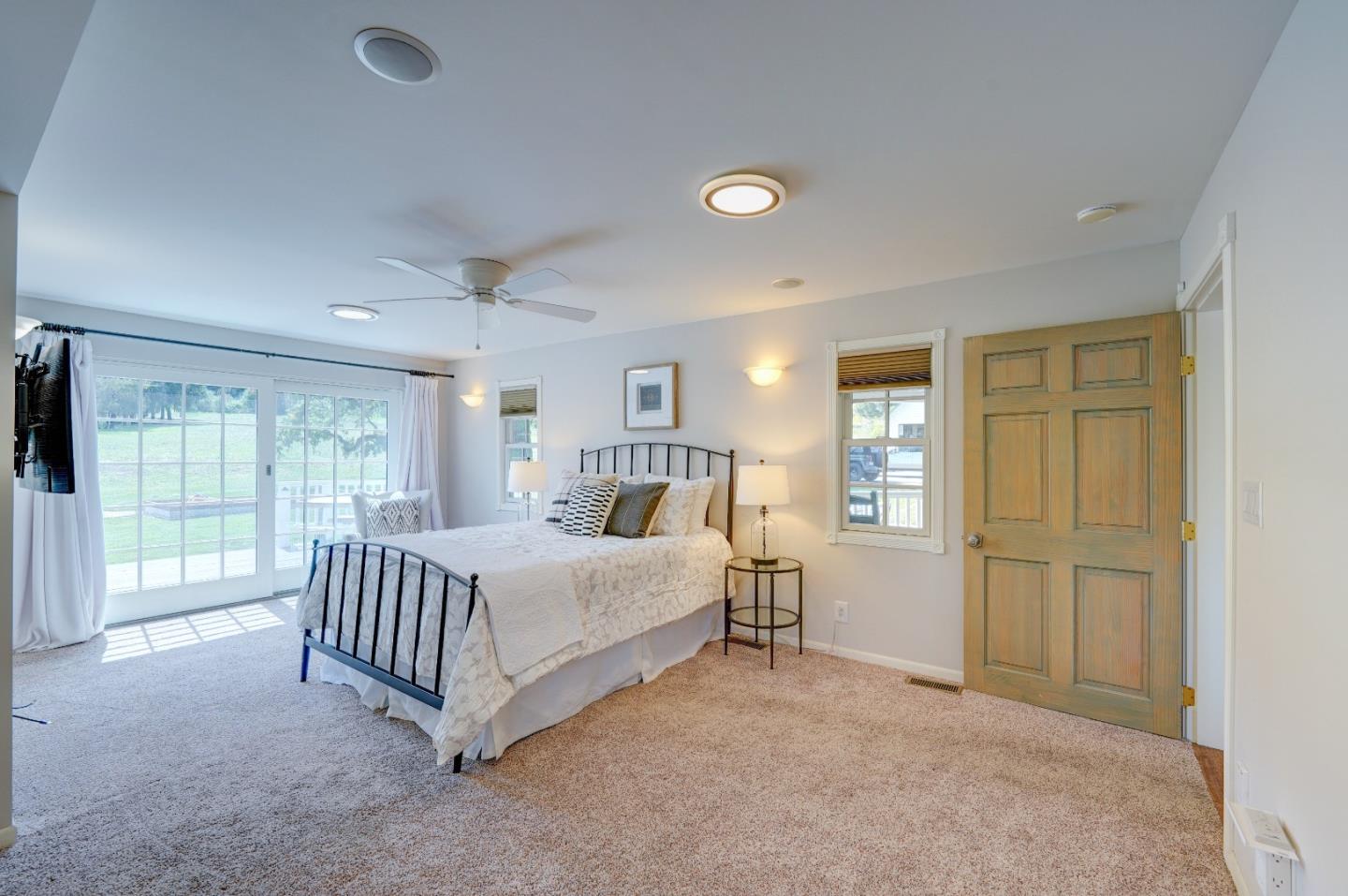 8495 Pharmer Road Gilroy, CA 95020 - Photo 24 of 70 a spacious bedroom with a bed and large window