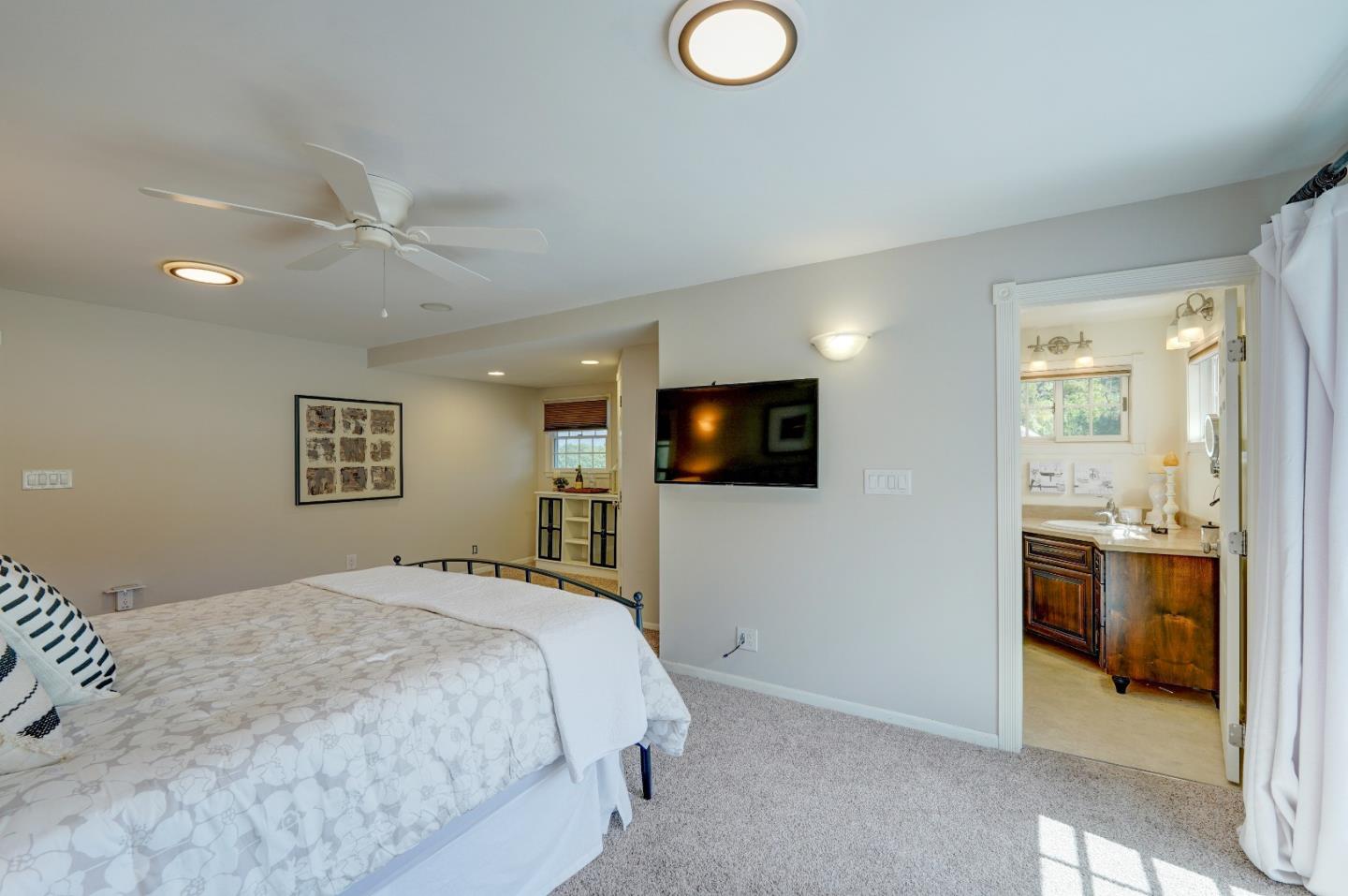 8495 Pharmer Road Gilroy, CA 95020 - Photo 26 of 70 a bedroom with a bed and a television