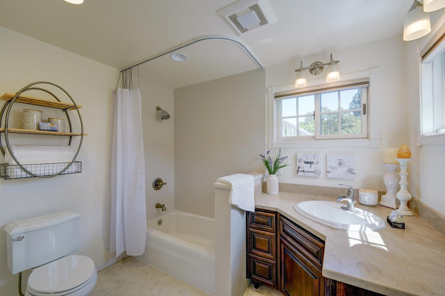 8495 Pharmer Road Gilroy, CA 95020 - Photo 27 of 70 a bathroom with a sink a toilet and a bathtub
