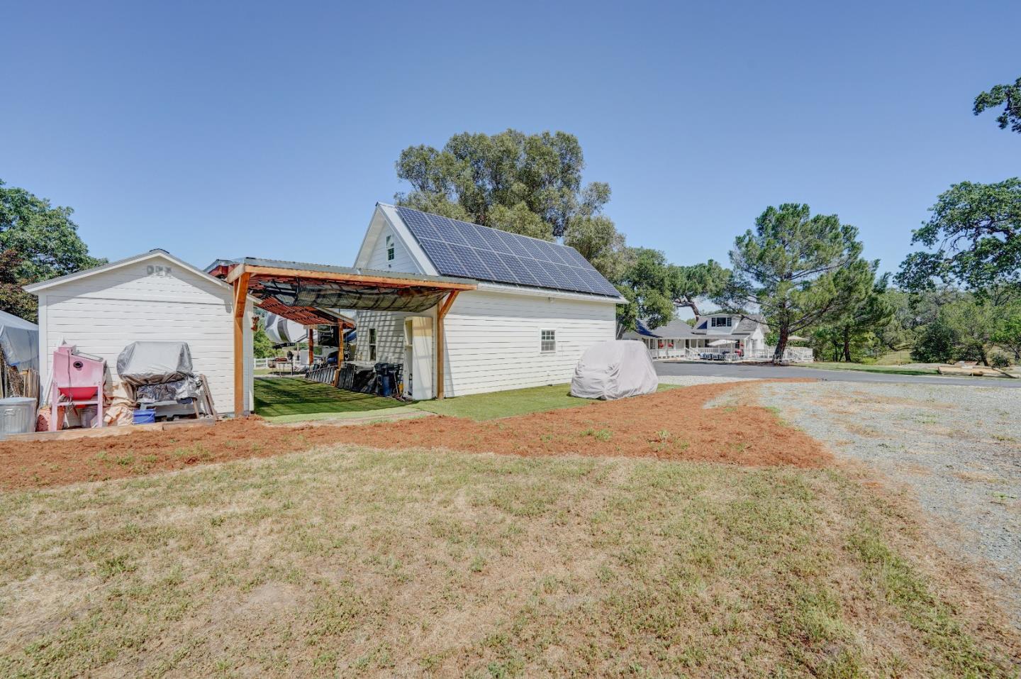 8495 Pharmer Road Gilroy, CA 95020 - Photo 59 of 70 a front view of a house with a yard and garage