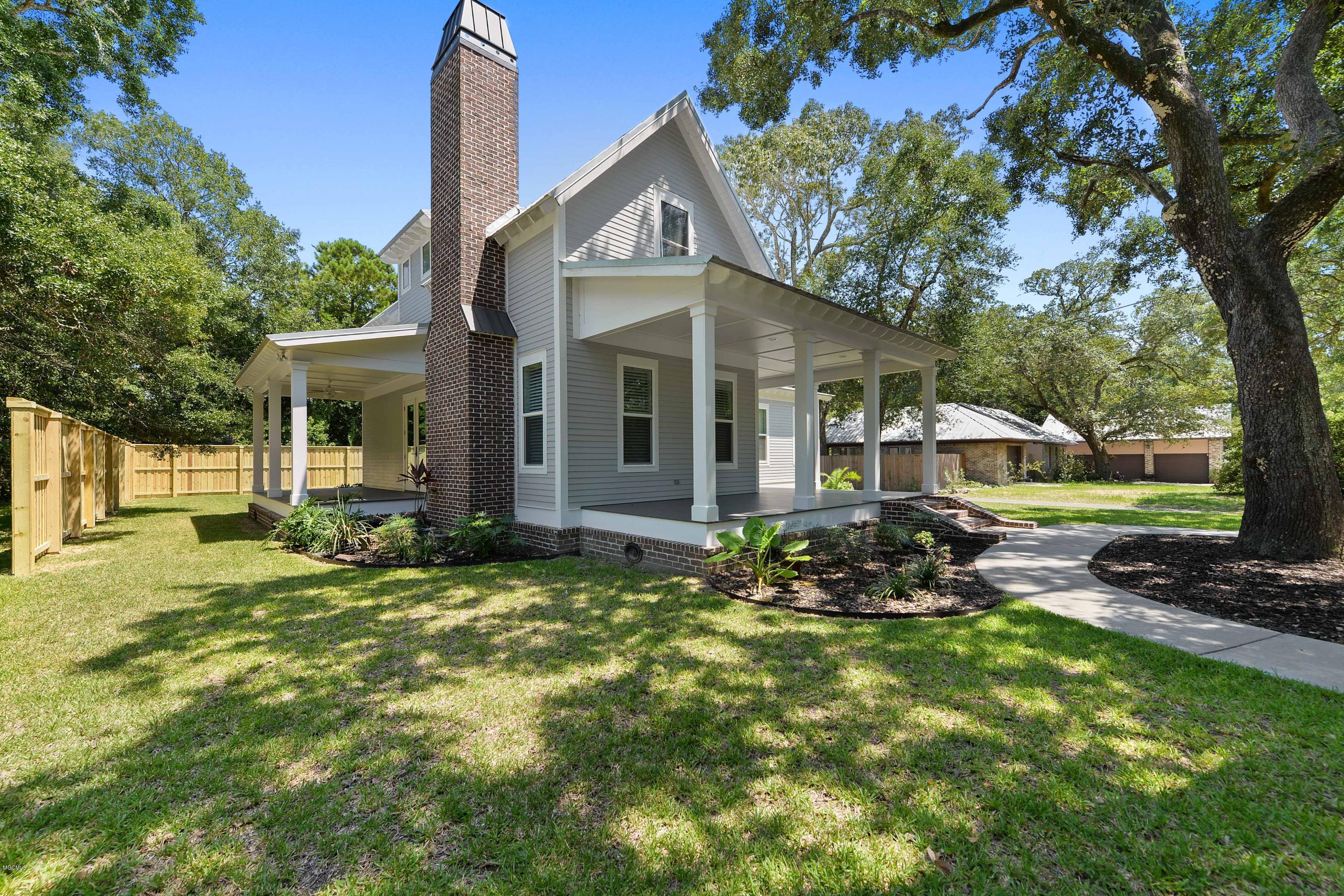 204 E Halstead Road Ocean Springs, MS 39564 - Photo 3 of 34 EXTERIOR FRONT AND SIDE PATIO