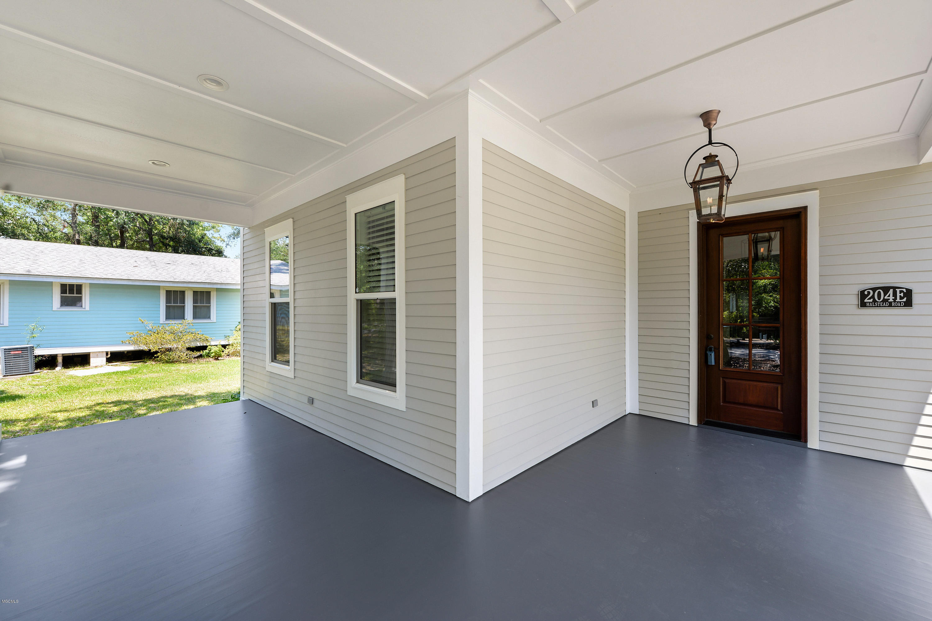 204 E Halstead Road Ocean Springs, MS 39564 - Photo 4 of 34 FRONT PATIO WITH GAS LAMP