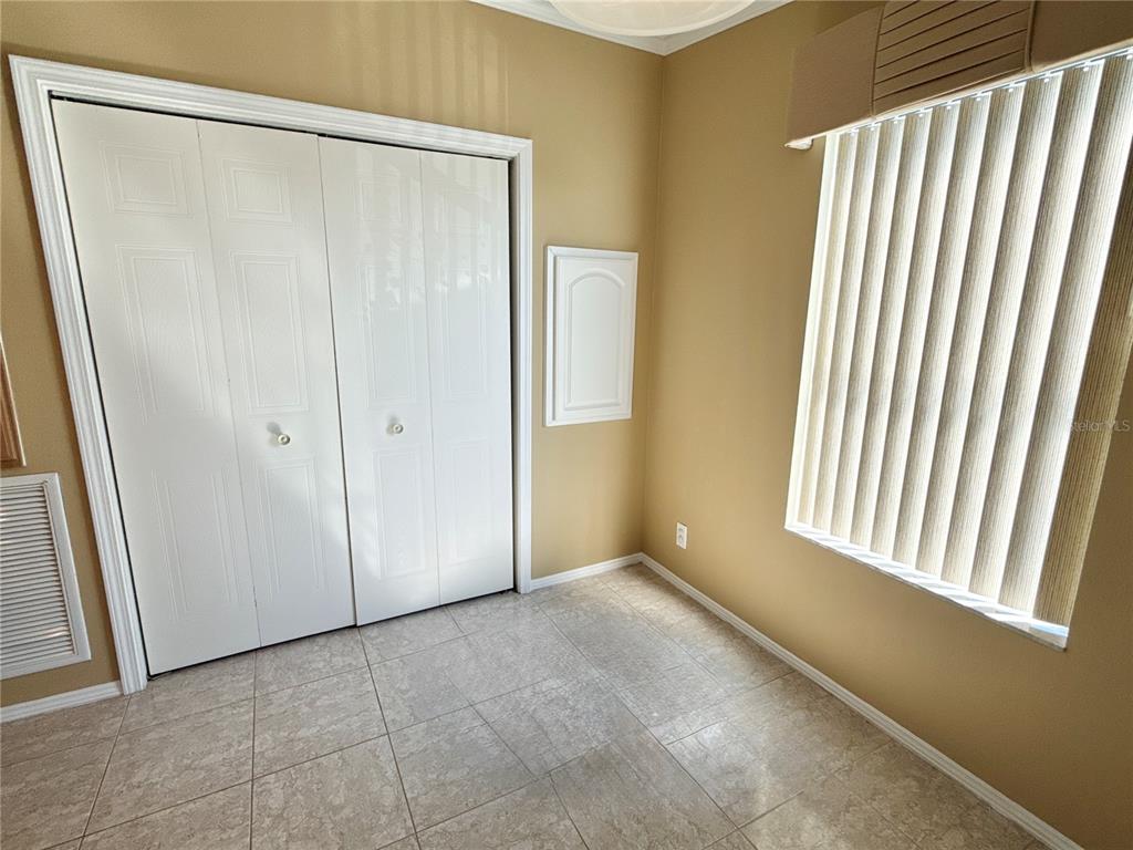 6817 Mt Pleasant Road Northeast, Unit 49 St. Petersburg, FL 33702 - Photo 11 of 30 a view of an empty room with a window