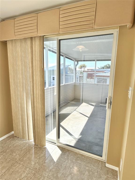 6817 Mt Pleasant Road Northeast, Unit 49 St. Petersburg, FL 33702 - Photo 13 of 30 a view of a room with a porch