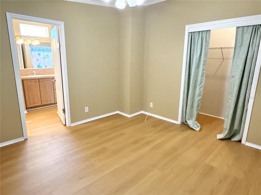 6817 Mt Pleasant Road Northeast, Unit 49 St. Petersburg, FL 33702 - Photo 17 of 30 an empty room with windows