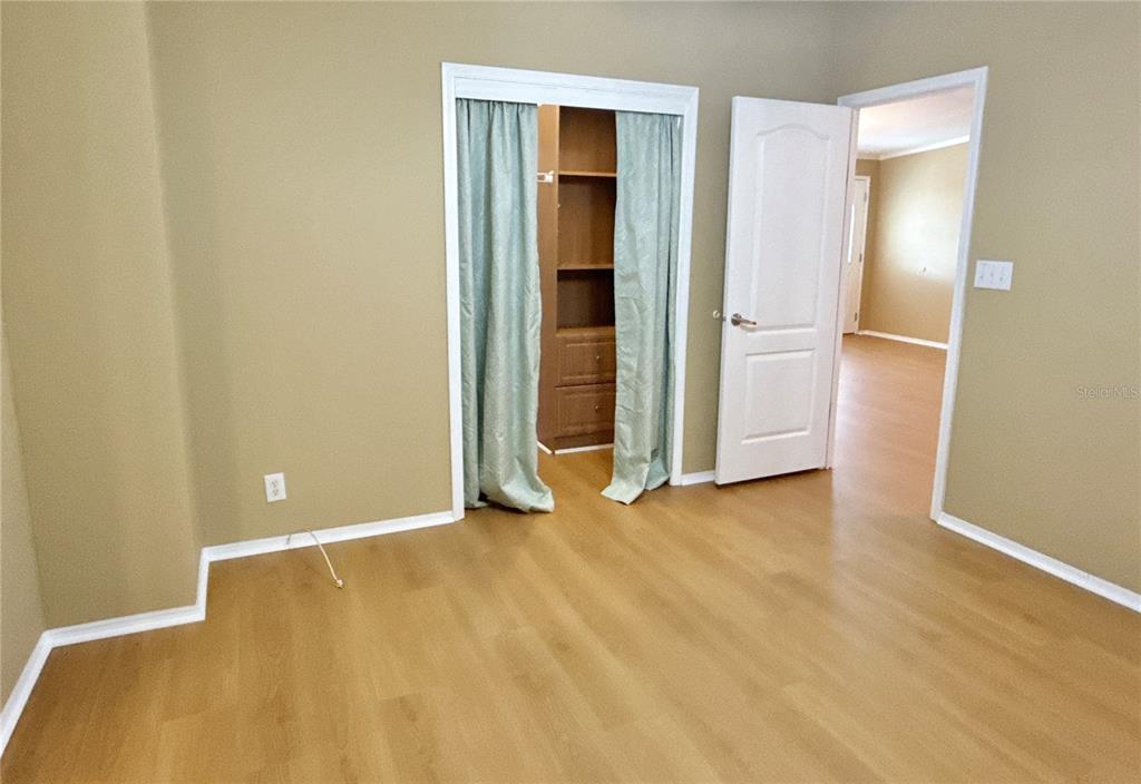 6817 Mt Pleasant Road Northeast, Unit 49 St. Petersburg, FL 33702 - Photo 18 of 30 a view of an empty room with closet area