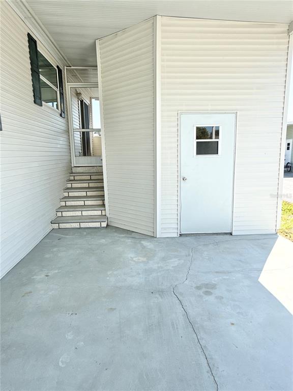 6817 Mt Pleasant Road Northeast, Unit 49 St. Petersburg, FL 33702 - Photo 2 of 30 a view of a house with stairs and furniture