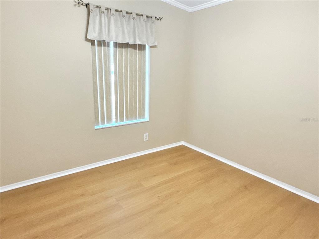 6817 Mt Pleasant Road Northeast, Unit 49 St. Petersburg, FL 33702 - Photo 24 of 30 an empty room with window