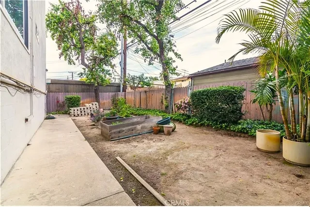 a view of a backyard with sitting area