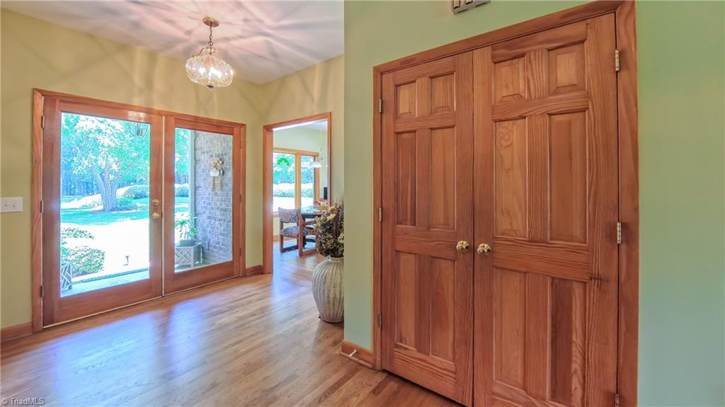 910 Whitney Court High Point, NC 27265 - Photo 1 of 24 Solid wood doors and large windows bring the warm natural setting indoors.