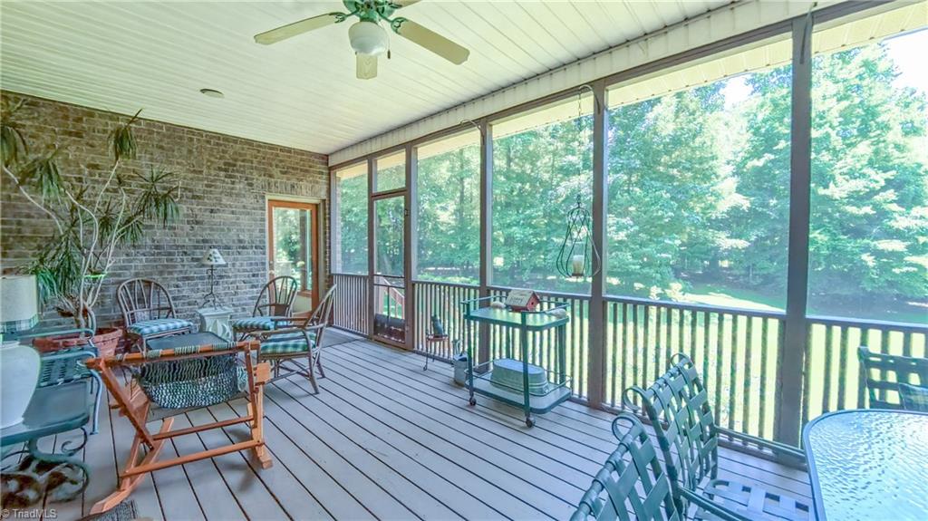 910 Whitney Court High Point, NC 27265 - Photo 23 of 24 The stunning covered porch overlooks a deep back yard full of nature and is accessible from multiple rooms.