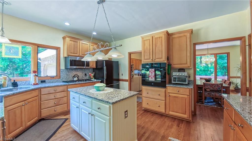910 Whitney Court High Point, NC 27265 - Photo 8 of 24 The well appointed kitchen flows perfectly around a central island.