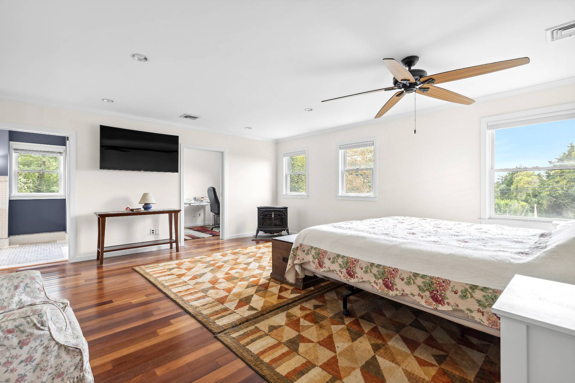 573 North Sea Mecox Road Southampton, NY 11968 - Photo 13 of 21 a bedroom with a bed and a flat screen tv