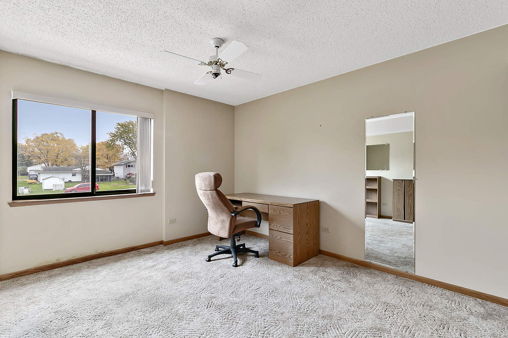 937 East Division Street, Unit 2D Lockport, IL 60441 - Photo 12 of 18 a view of a workspace with furniture and a window