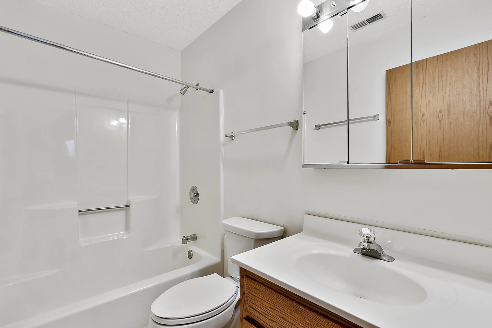 937 East Division Street, Unit 2D Lockport, IL 60441 - Photo 13 of 18 a bathroom with a sink toilet and shower