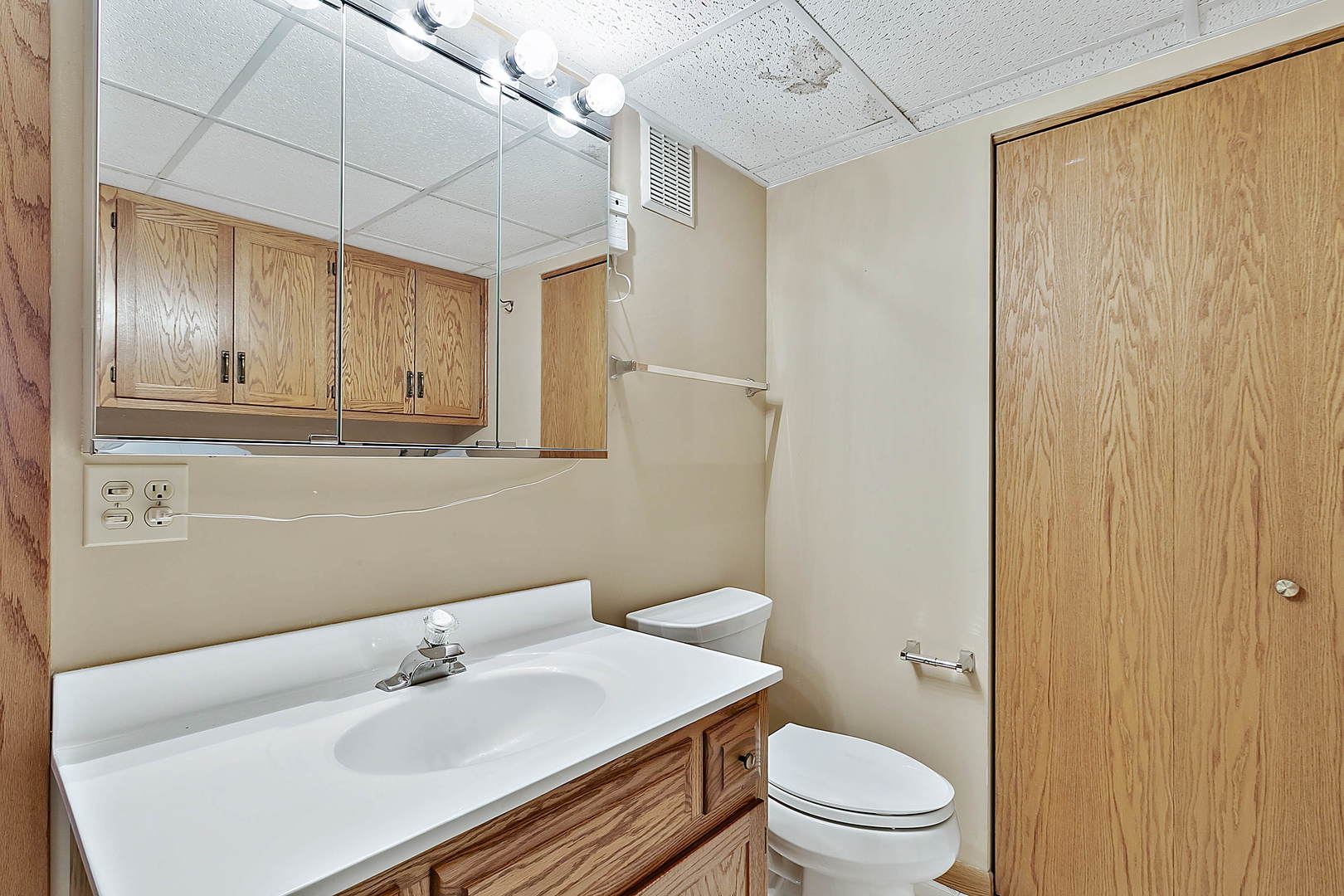 937 East Division Street, Unit 2D Lockport, IL 60441 - Photo 15 of 18 a bathroom with a sink toilet and vanity