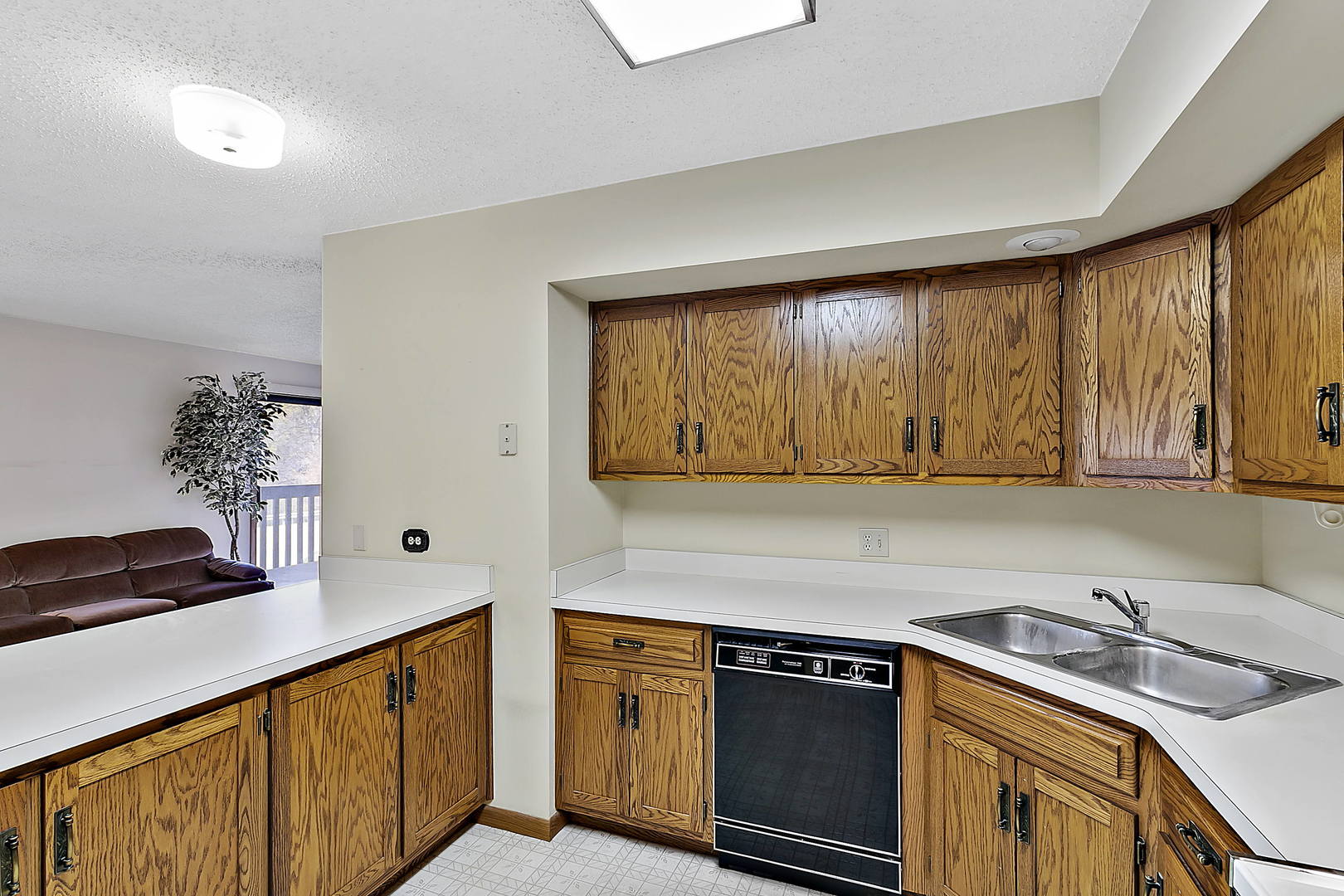 937 East Division Street, Unit 2D Lockport, IL 60441 - Photo 5 of 18 a kitchen with a sink stove and cabinets