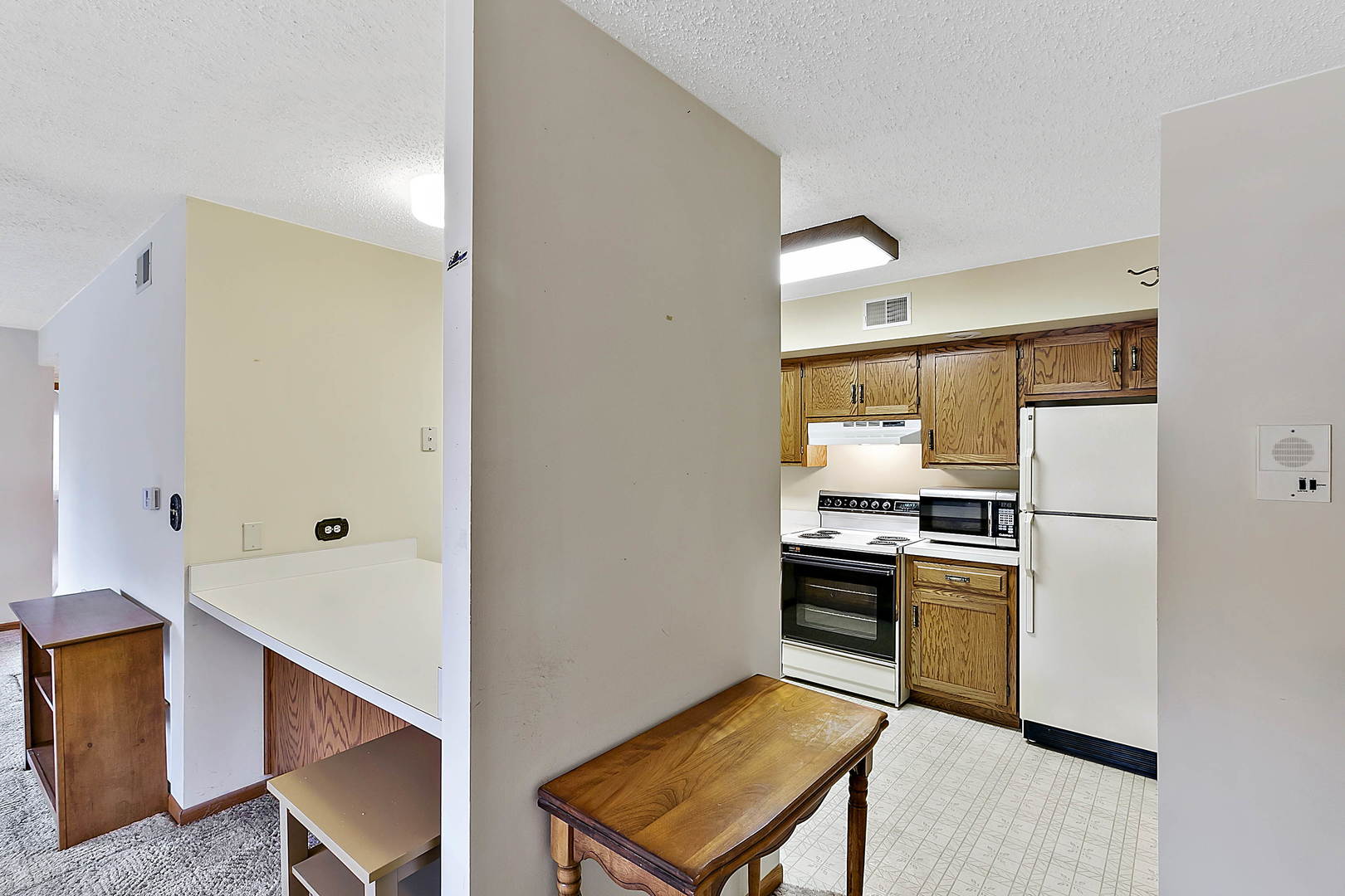 937 East Division Street, Unit 2D Lockport, IL 60441 - Photo 7 of 18 a kitchen with cabinets and stainless steel appliances