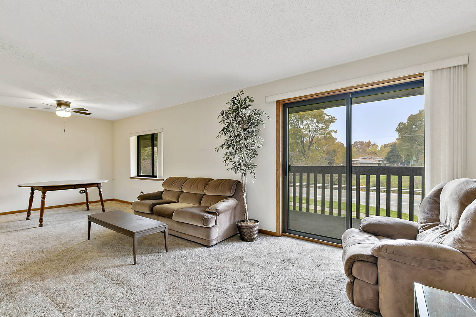 937 East Division Street, Unit 2D Lockport, IL 60441 - Photo 10 of 18 a living room with furniture and a window