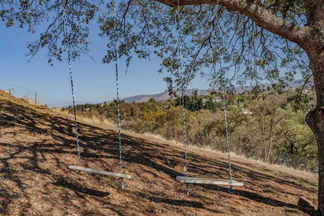 a view of a backyard of the house