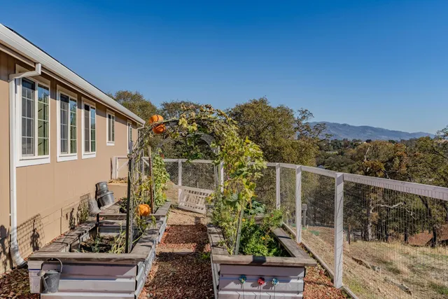 a view of a chair and tables in the balcony