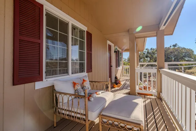 a view of balcony with furniture