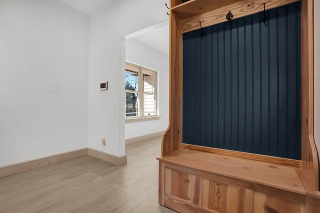 a view of an entryway with wooden floor